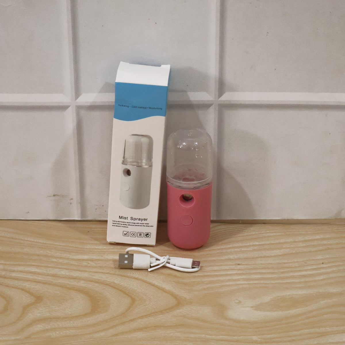 Woman using mist sprayer for daily skincare