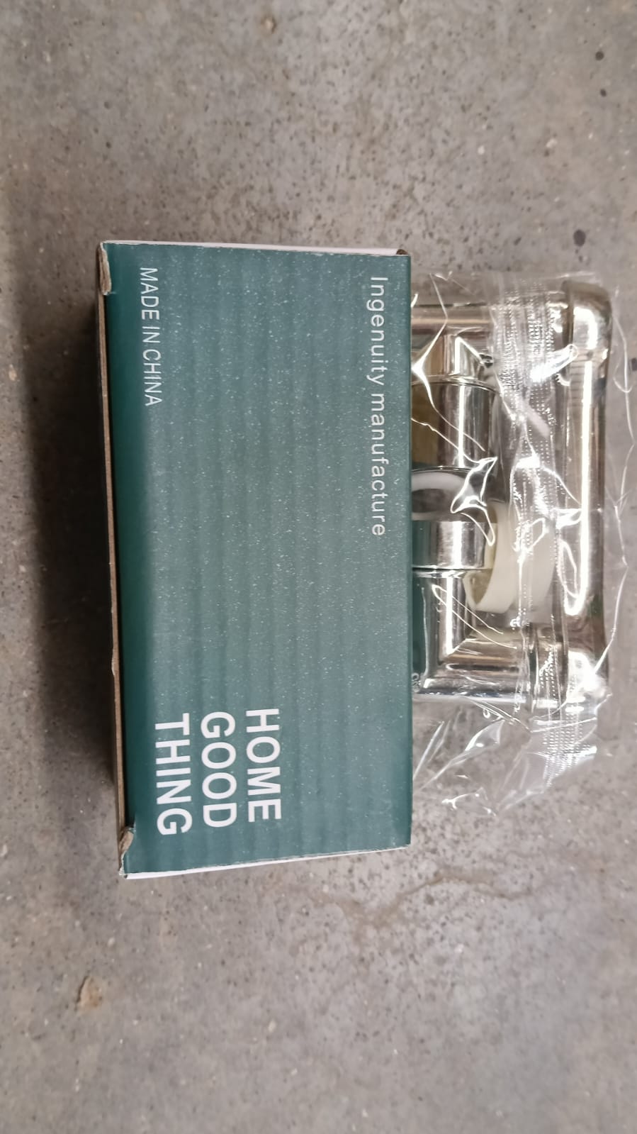 The back of the product packaging for the chrome swivel faucet aerator, labeled 'HOME GOOD THING' and 'MADE IN CHINA'.