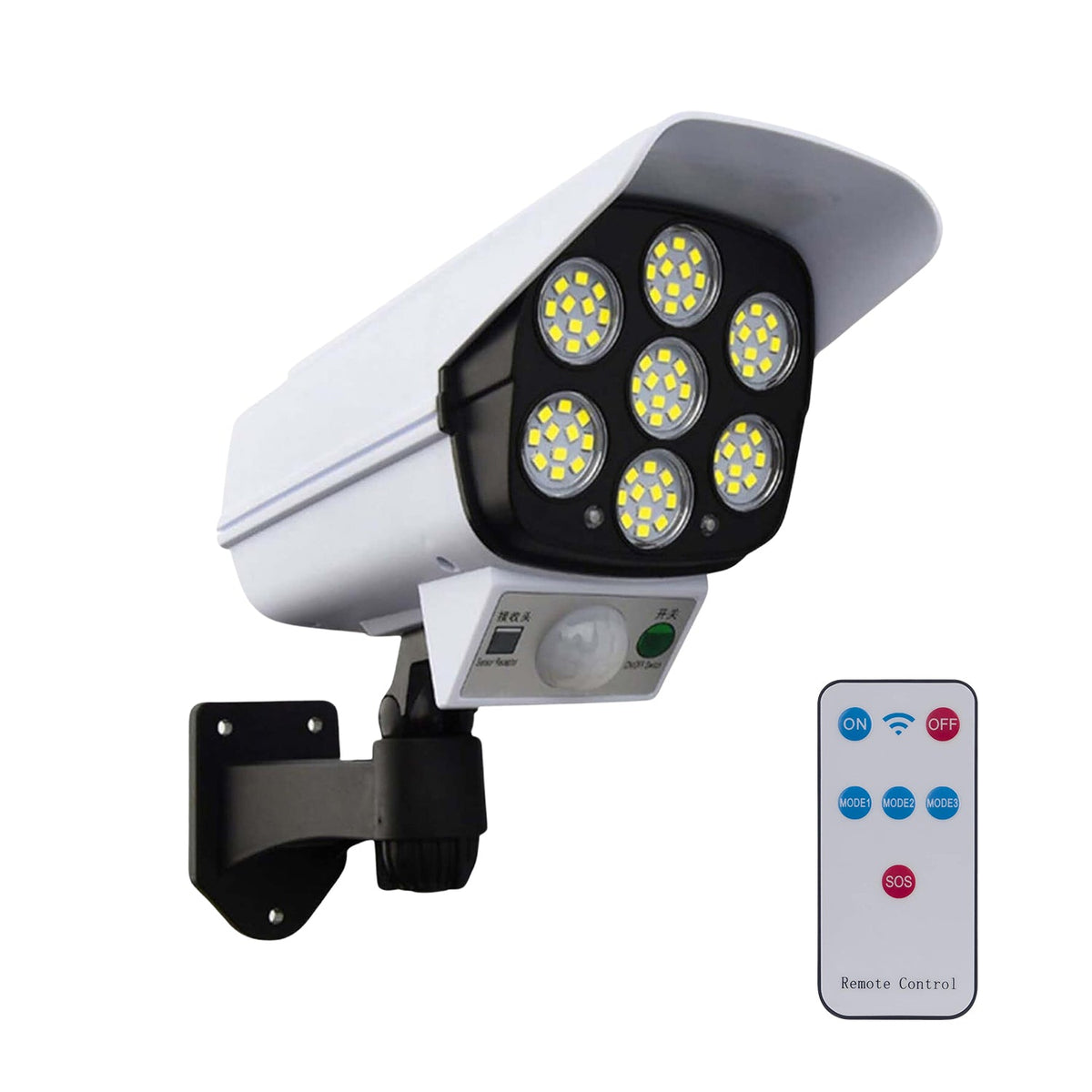 White dummy security camera with seven LED lights and a remote control on a white background.