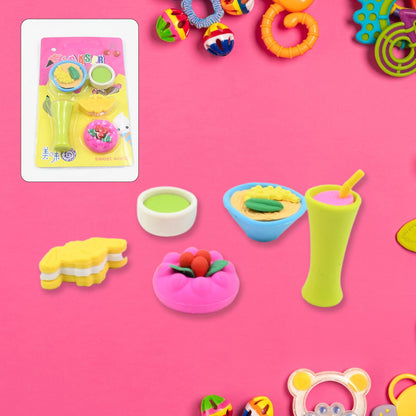 Five food-shaped erasers, including a green drink, a bowl of ramen, a pink cake, and a yellow sandwich, are on a pink