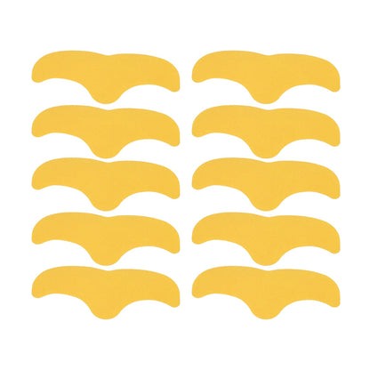 Ten gold, curved forehead patches are arranged neatly on a white background.