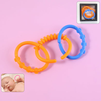 Three interconnected orange and blue learning links on a pink background, with an inset of a baby and a box. – view 7