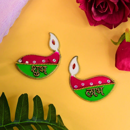 Two colorful diya-shaped stickers with 'Shubh' and 'Labh' in gold, adorned with pink, green, and clear gems.