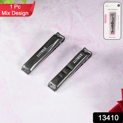 Two black and silver nail clippers on a pink marble surface, with packaging for one in the top right.