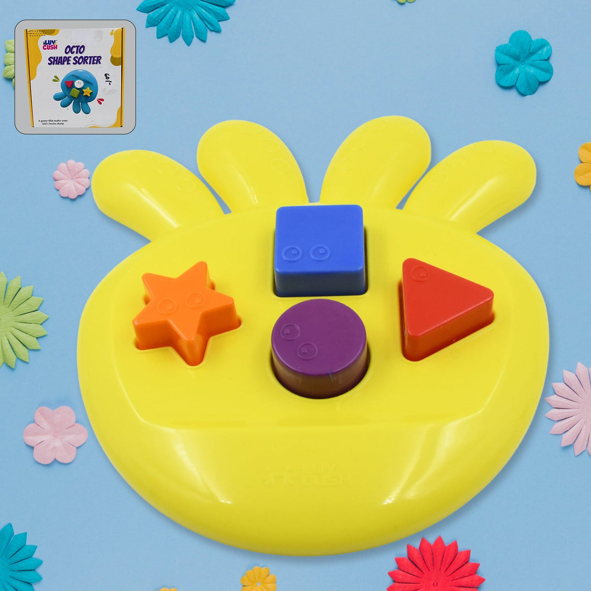 Yellow shape sorter with blue square, orange star, red triangle, and purple circle blocks on a blue surface.