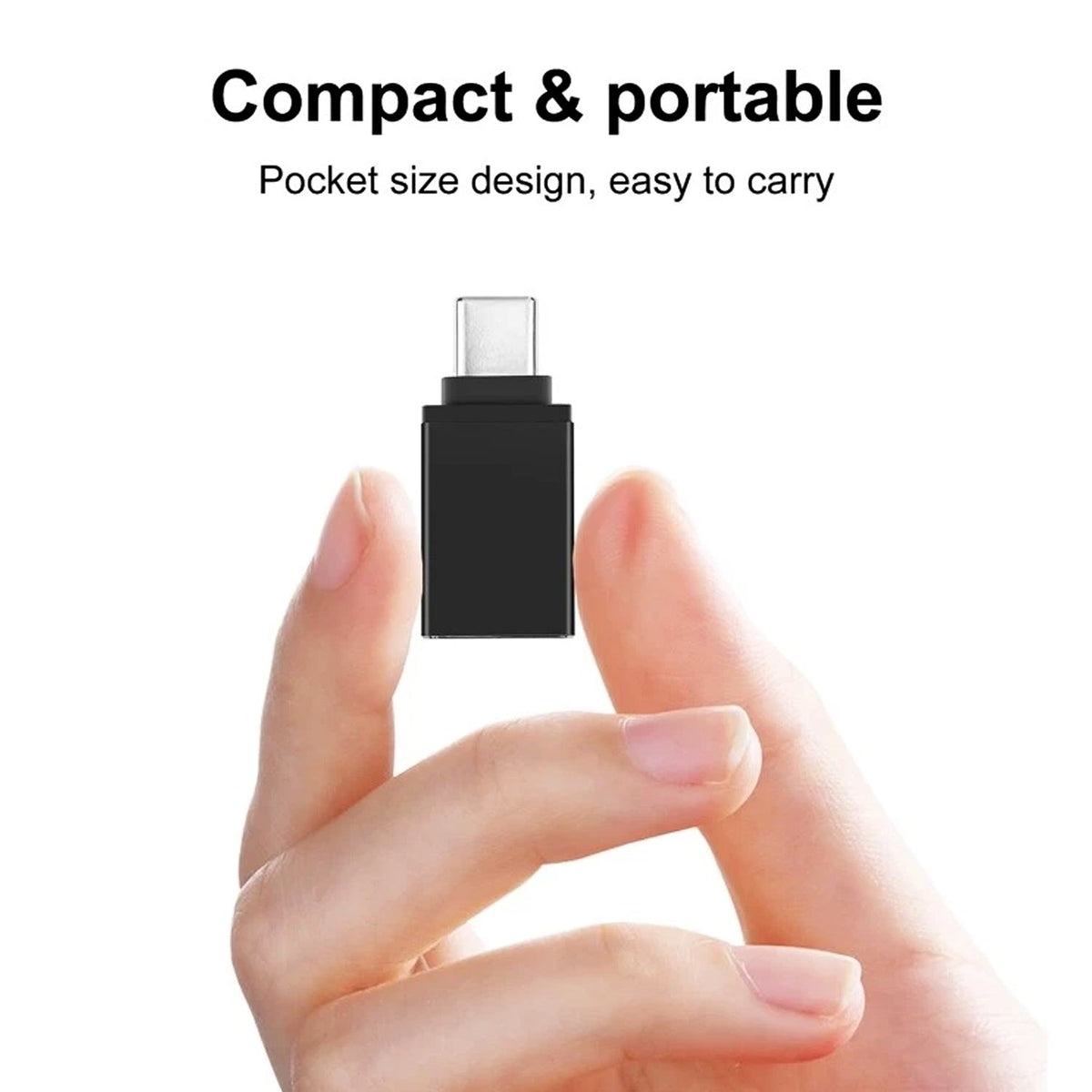 A hand holds a small black USB-C to USB 3.0 OTG adapter on a white background, emphasizing its compact size.