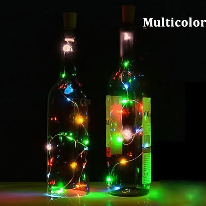 Two clear bottles with multicolor LED string lights inside, glowing in a dark setting.