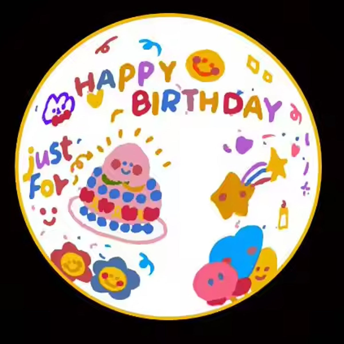 A circular projection of a colorful 'Happy Birthday just for you' design with a cake, stars, and flowers.