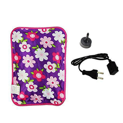 A purple hot water bag with pink and white flowers is shown with its black charging cable and a black stopper.