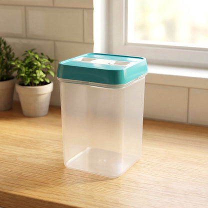 Empty clear plastic food storage container with a teal lid on a wooden kitchen counter near a window.