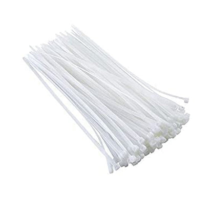 A large, scattered pile of white nylon cable ties with their ends fanned out on a white background.