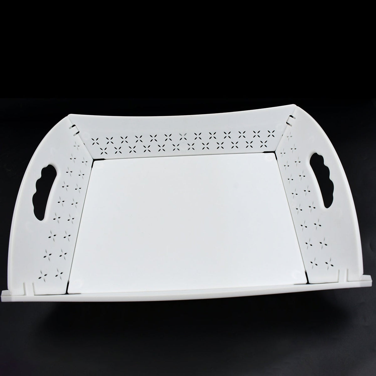 A white foldable serving tray is displayed unfolded on a black background.