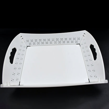 A white foldable serving tray is displayed unfolded on a black background.
