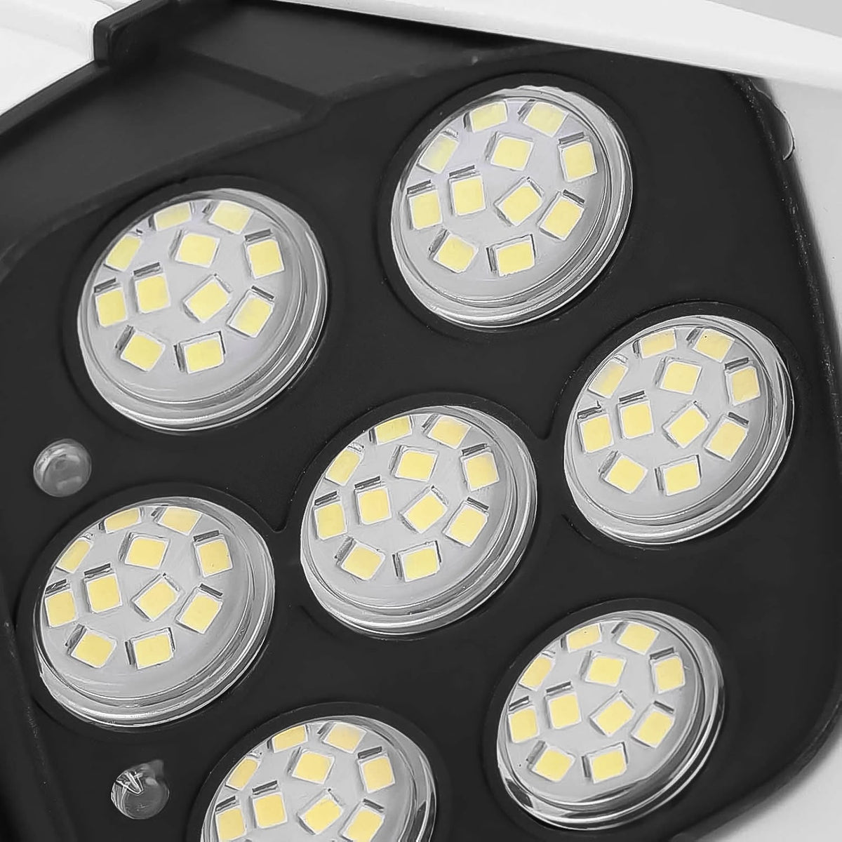 The solar-powered dummy security camera with lights from a different perspective.