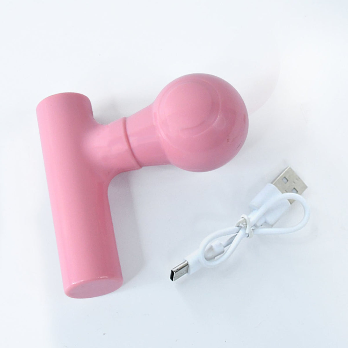 Top view of the black body massager, highlighting its simple one-button operation.