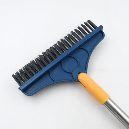 Close-up of the blue brush head with black bristles and yellow squeegee, attached to a silver handle.