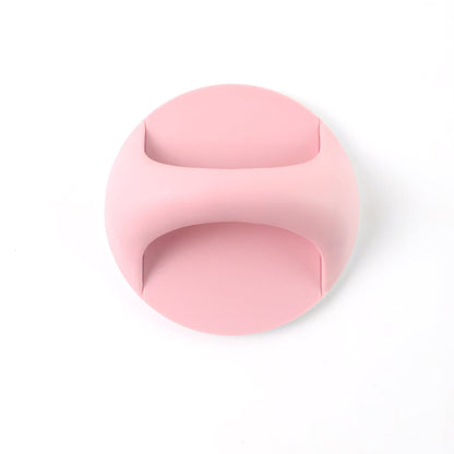 A pink self-adhesive handle is centered on a plain white background.