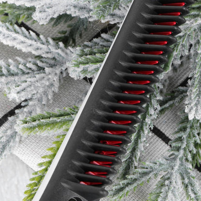A close-up shows the black comb with red bristles, against a background of frosted green foliage.