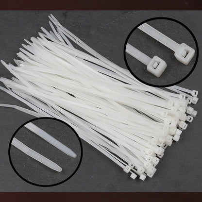 A pile of white nylon cable ties on a dark background, with insets showing close-ups of the locking head and tapered end.