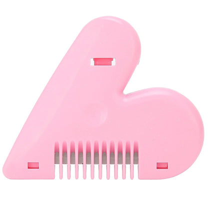 A top-down view of a pink heart-shaped hair thinning razor comb, showing the blades between the teeth.