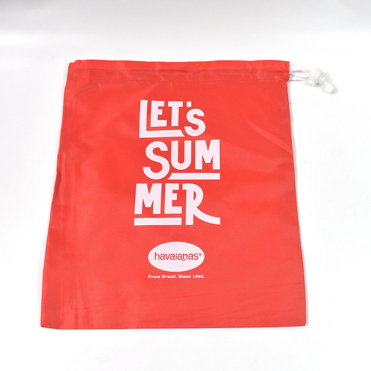 A red drawstring bag with "LET'S SUMMER" and Havaianas logo, laid flat on a plain white background.