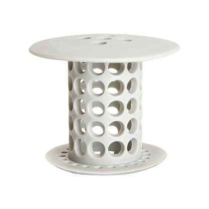 A white silicone tub drain hair catcher with many holes stands on a white background.