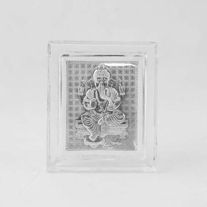 Front view of a silver-plated Ganesha idol in a clear acrylic frame on a plain white background.