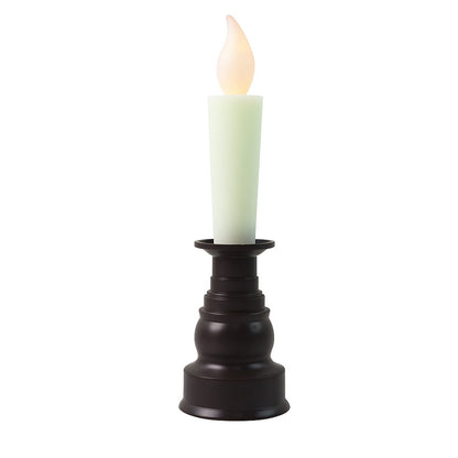 A single cream LED candle with a flickering flame in a dark bronze holder on a white background.