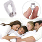 A clear silicone anti-snore nose clip held between fingers, with a family sleeping peacefully in the background.