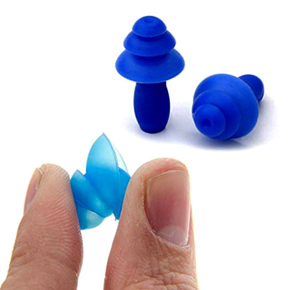 A hand holds a light blue earplug, with two blue silicone earplugs visible in the background.