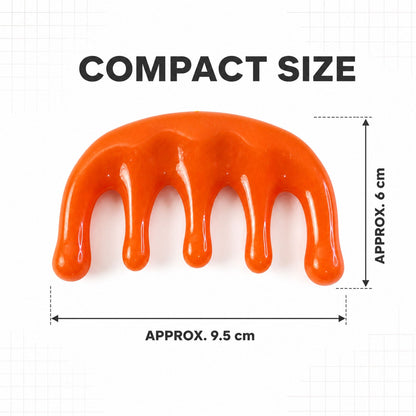 An orange plastic scalp massager on a white background with dimensions: approximately 9.5 cm wide and 6 cm high.