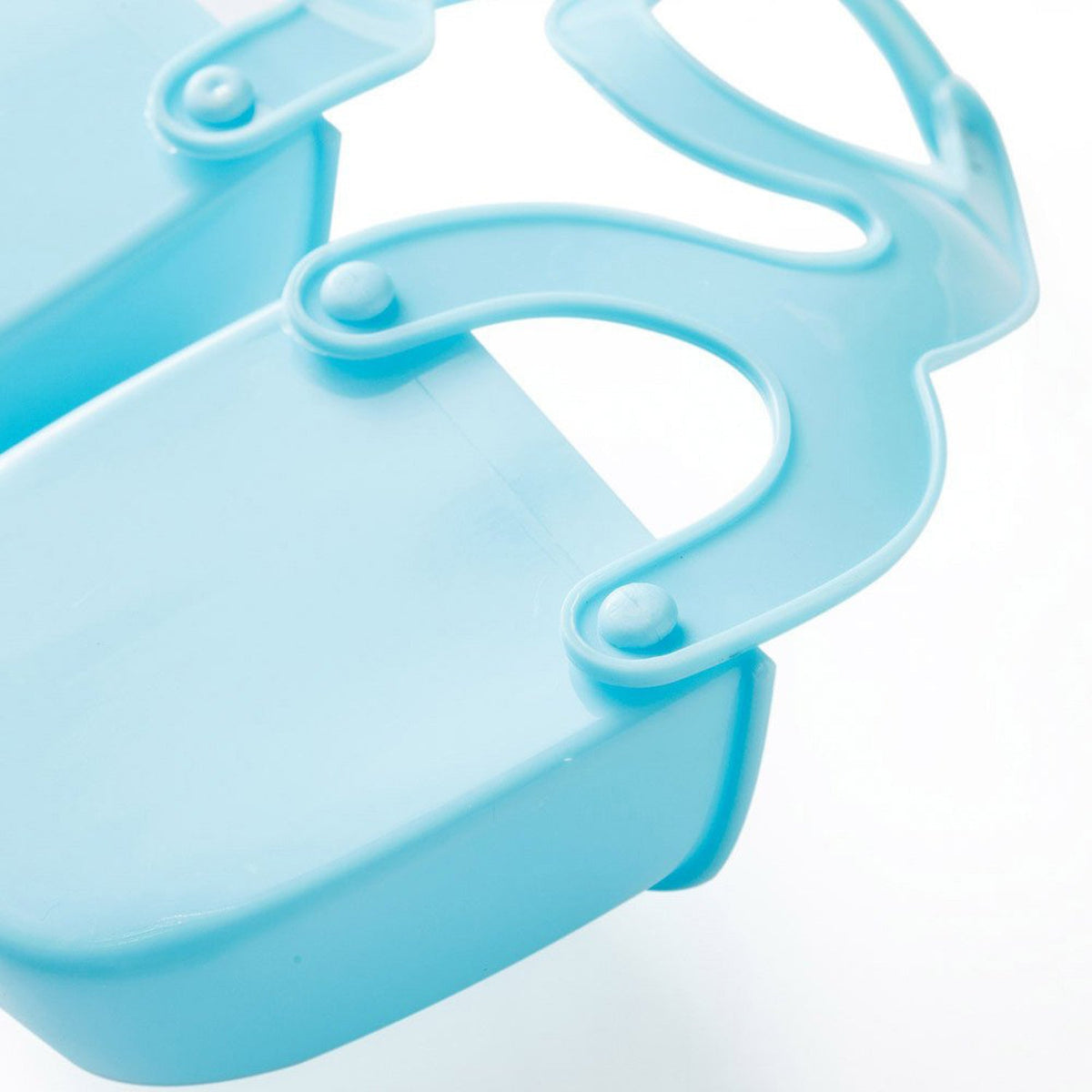 Close-up of the blue plastic caddy's adjustable strap mechanism connecting to a compartment.