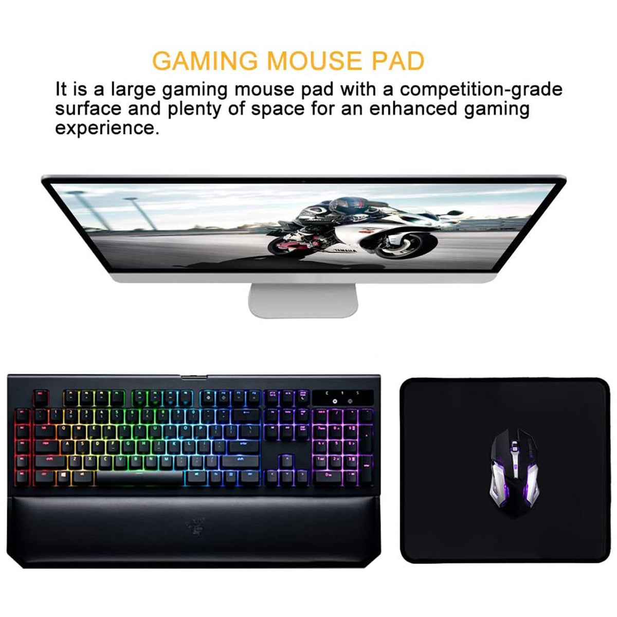 A black mouse pad with a gaming mouse next to a colorful gaming keyboard and a monitor displaying a motorcycle.