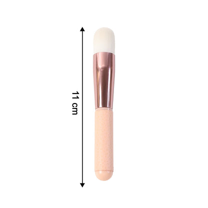 A pink and rose gold makeup brush with a white brush head, showing an 11 cm length measurement.