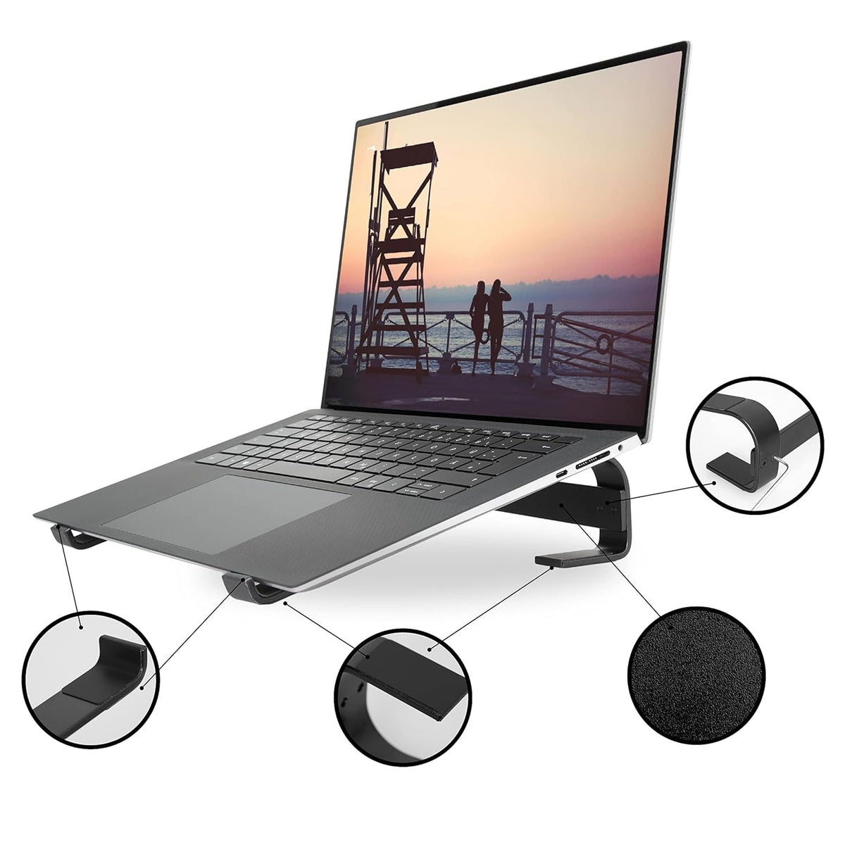 A silver laptop on a black stand with callouts highlighting the stand's features.