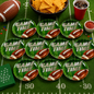Ten green paper plates with a football and 'GAME TIME' text, surrounded by football-themed party items.