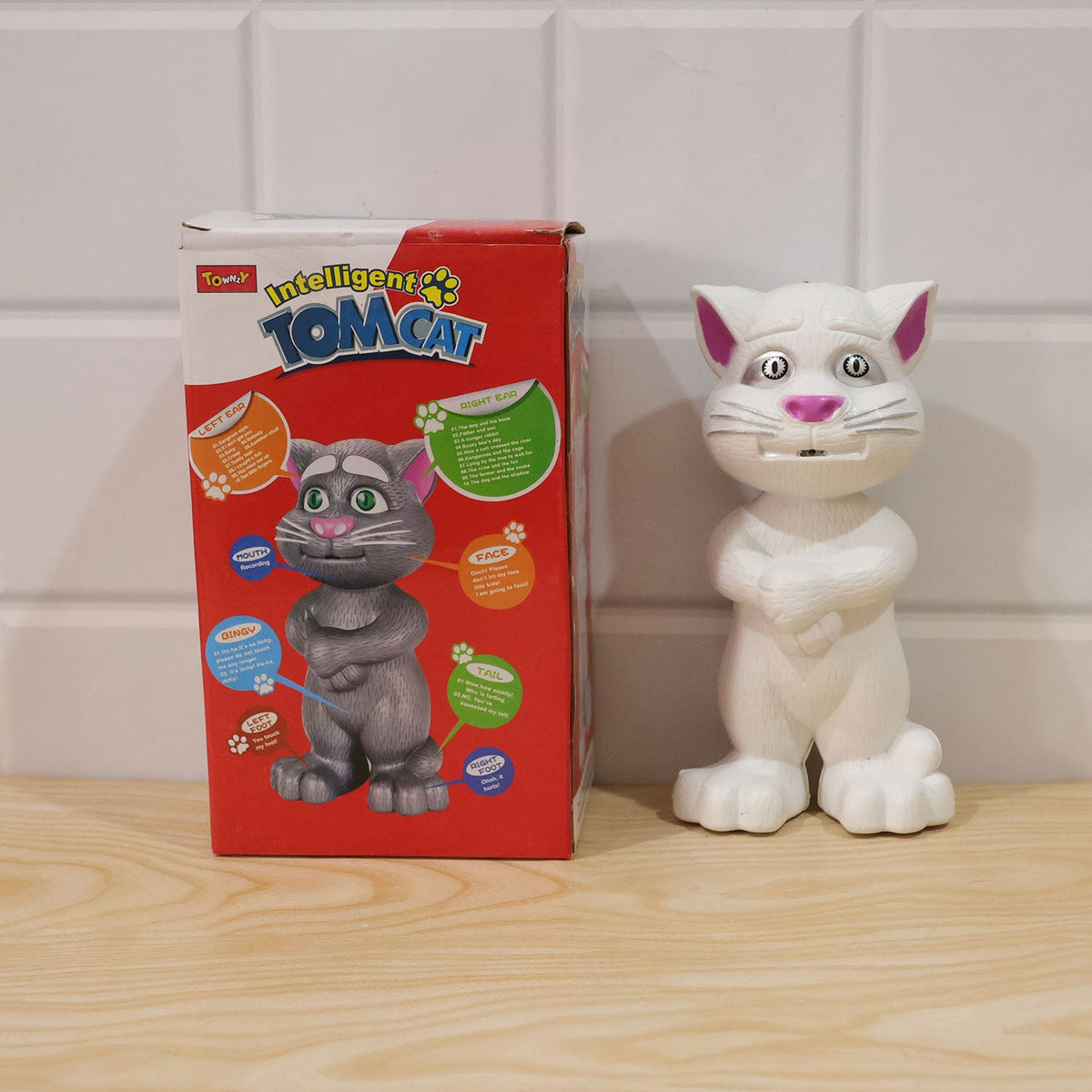 Front view of the white interactive mimicking cat toy with packaging
