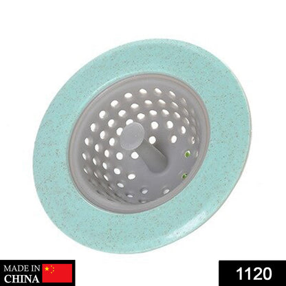 A mint green and gray sink strainer is shown from above, with a "Made in China" label and number "1120".