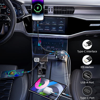 An interior car shot showing the 4-in-1 charger in use, charging a phone on the dashboard, a phone on the seat, and a tablet.