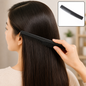 A woman with long dark hair is combing it with a black dual-tooth comb, with a smaller inset showing the comb.