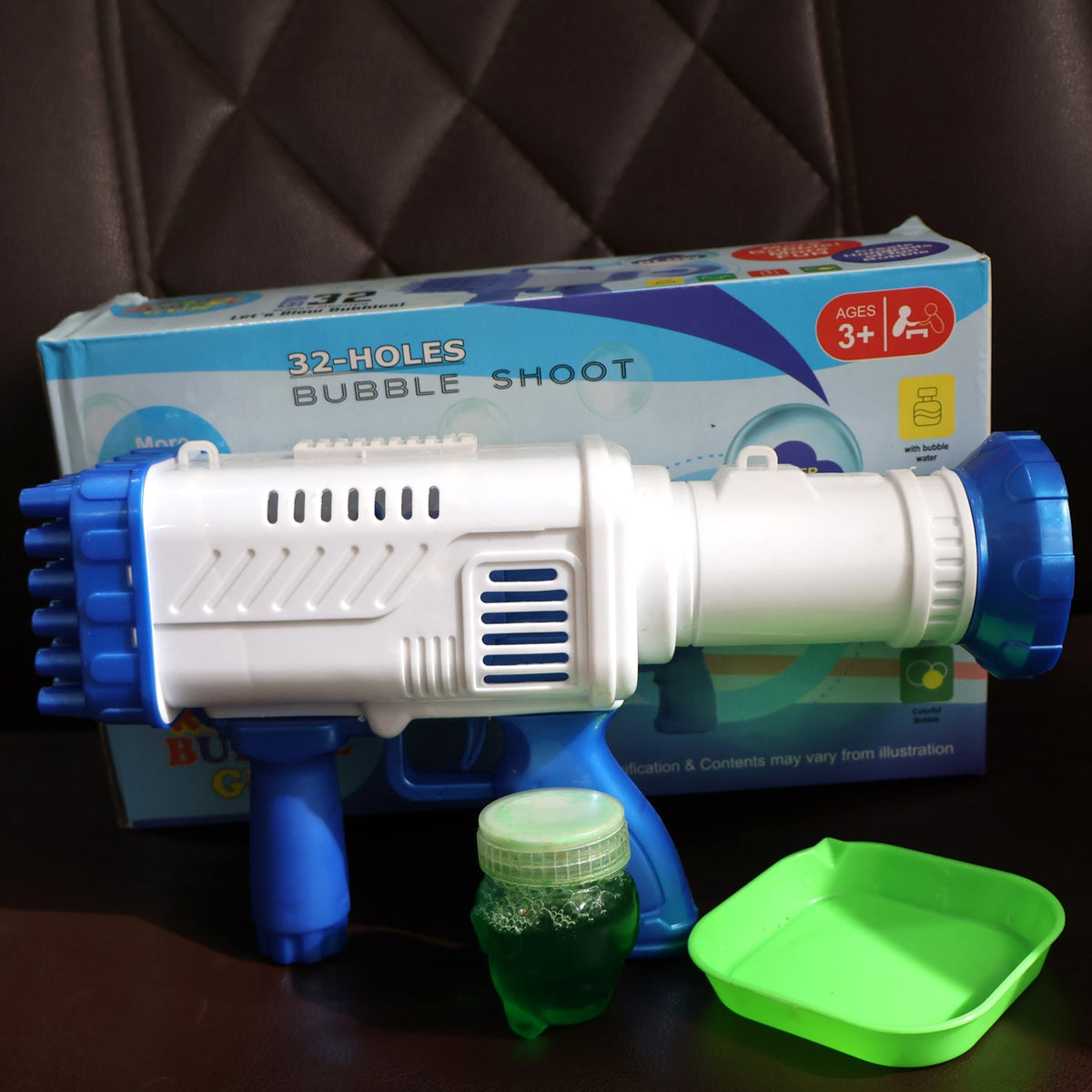 Packaging for the Play & Move white and blue 32-hole bubble gun.