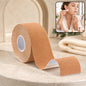 A roll of tan face lifting tape sits on a marble counter, with an inset showing a woman applying small pieces to her face.