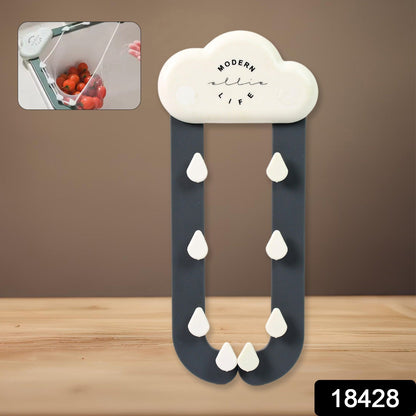A white cloud-shaped holder with dark grey rain-like arms and white raindrop hooks. An inset shows red tomatoes in a mesh