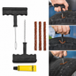 A complete tire repair kit with two T-handle tools, three brown repair strips, and a yellow tube of rubber solution.