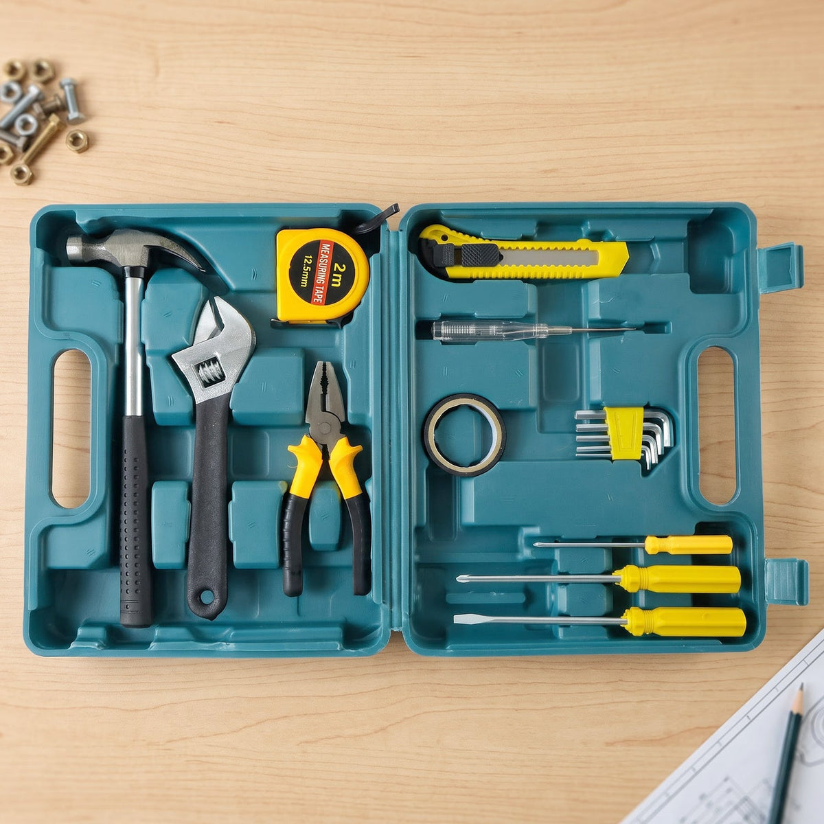 An open teal plastic toolbox contains a hammer, adjustable wrench, pliers, tape measure, utility knife, and various