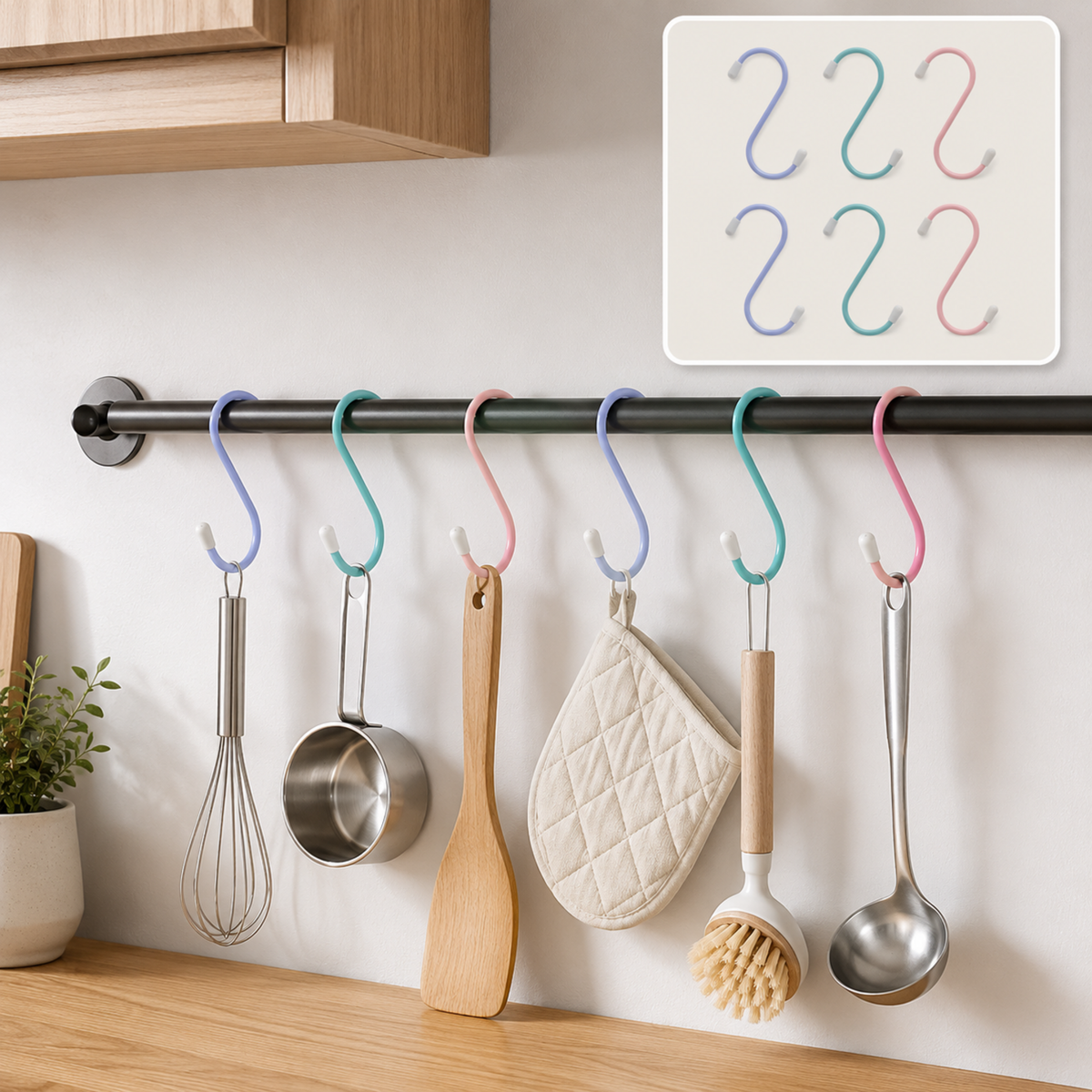 Six colorful plastic coated S hooks hanging kitchen utensils on a black rod in a modern kitchen.