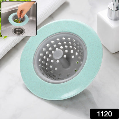 A mint green and grey silicone sink strainer basket on a marble counter, with the number 1120 in the bottom right corner.