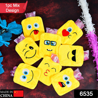 Seven yellow emoji hot water bags with various facial expressions are arranged on a dark wooden surface