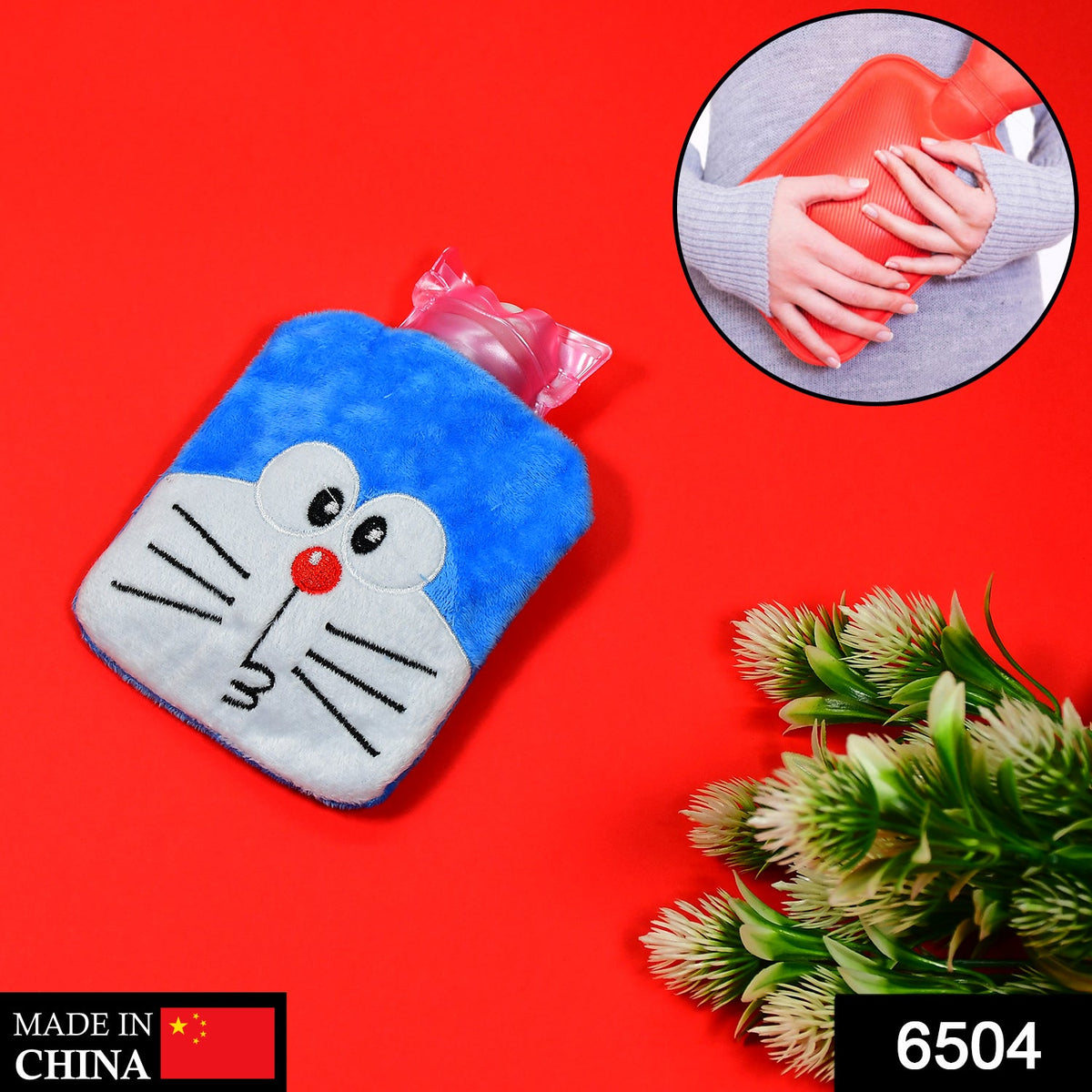 Blue Doraemon plush hot water bag with a pink stopper, on a red background with a small plant to the right.