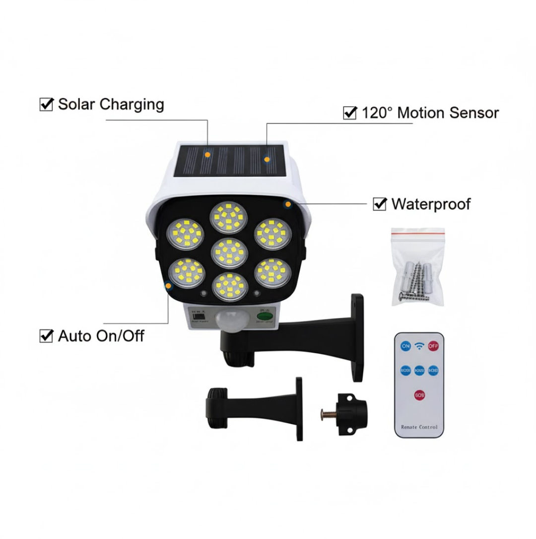 White dummy security camera with seven LED lights, solar panel, remote control, and mounting hardware on a white background.